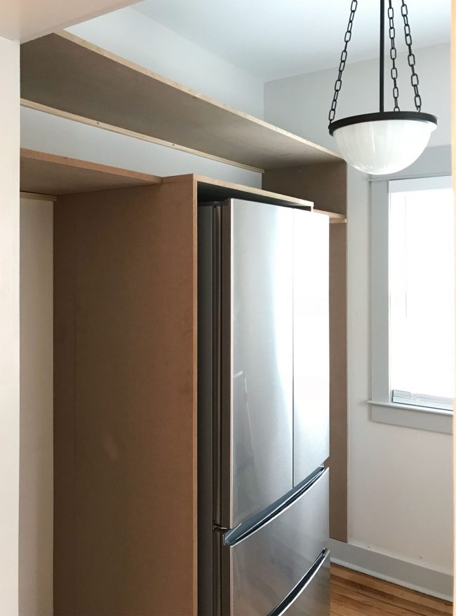 two long horizontal pantry shelves added on top of vertical pieces