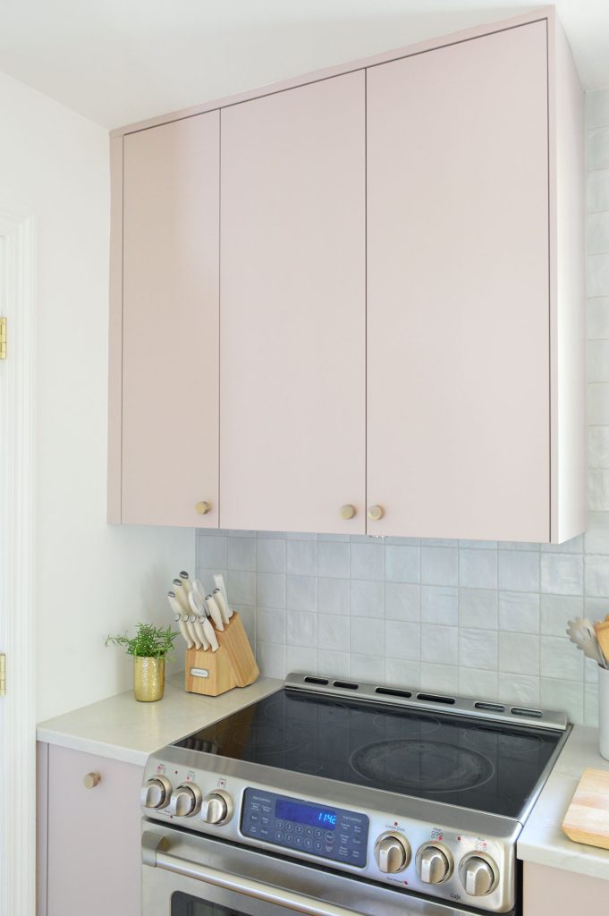 Upper Cabinet In Painted Ikea Kitchen With Hidden Omsinnad Hood Over STove