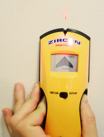 using a Zircon digital stud finder to locate stud within a wall for DIY project