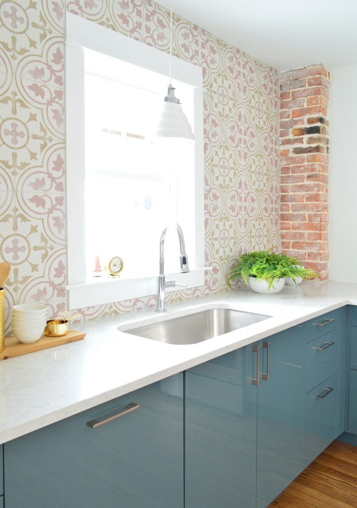Pink Patterned Tile In Blue Kitchen With Exposed Brick Chimney